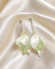 Close detail of ivory silk leaves and pale green beads on HUAVELLE Ronghua earrings