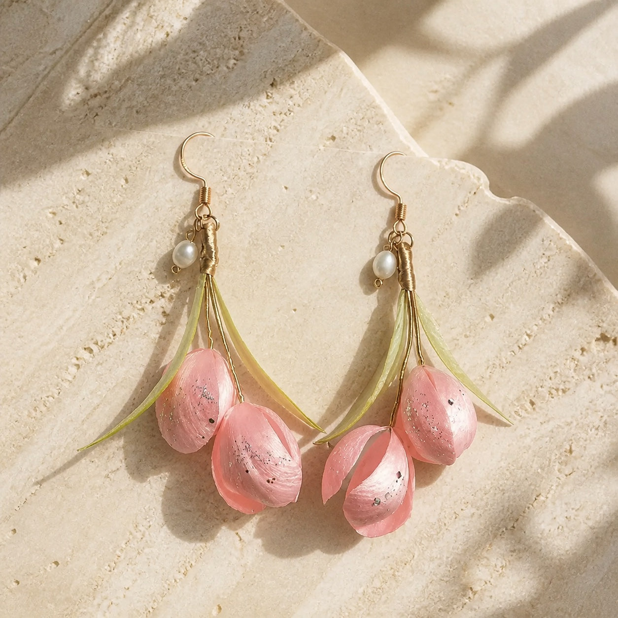 Pair of pink peony Ronghua silk flower earrings on ivory stone